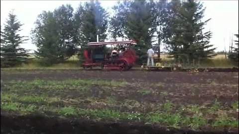 Holt Caterpillar Gasoline-Powered Tractor Pulling Eight Bottom Plow
